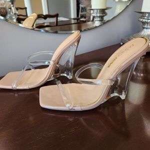 Nude and Clear high heel shoes
